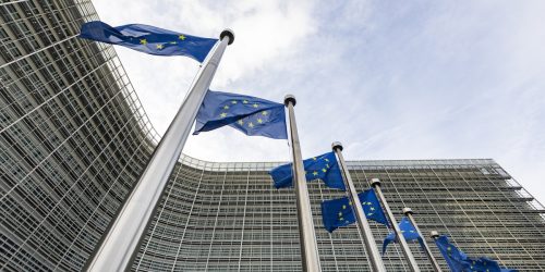 The flags of the European Union in front of the European Commission building in Brussels, Belgium
